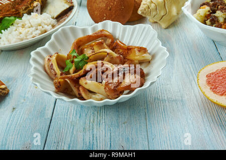 Adobong Pusit , Squid Adobo, Filipino cuisine, Traditional assorted dishes, Top view. Stock Photo