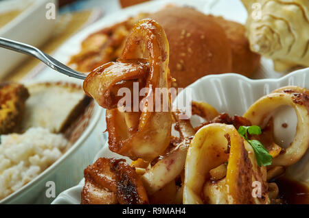 Adobong Pusit , Squid Adobo, Filipino cuisine, Traditional assorted dishes, Top view. Stock Photo