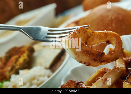 Adobong Pusit , Squid Adobo, Filipino cuisine, Traditional assorted dishes, Top view. Stock Photo