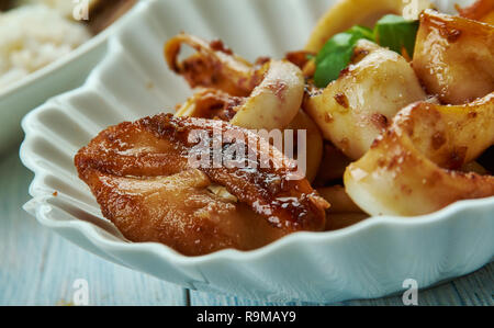 Adobong Pusit , Squid Adobo, Filipino cuisine, Traditional assorted dishes, Top view. Stock Photo