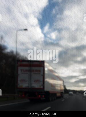 Close up of the wavy lines of a heated front windscreen from inside the car on a motorway Stock Photo