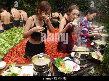 Hangzhou, China. 26th December, 2018. Tourists enjoy hot pot and spring at the hotpot shaped spring during winter at a hotel in Hangzhou, east China's  Zhejiang Province. Credit: SIPA Asia/ZUMA Wire/Alamy Live News Stock Photo
