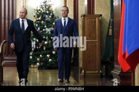Moscow, Russia. 26th December, 2018. Russian President Vladimir Putin walks with Prime Minister Dmitry Medvedev, right, as they arrive for the year end meeting with government leaders and officials at the Kremlin December 26, 2018 in Moscow, Russia. Credit: Planetpix/Alamy Live News Stock Photo