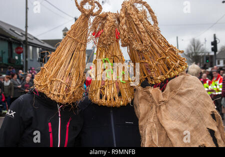 Carrigaline, Cork, Ireland. 26th December, 2018. Joanne Crowley, Anna O' Keeffe and Martha O' Shea from Carrigaline Comhaltas who dressed as Straw Boys as part of the annual St Stephen's Day celebrations that was held in Carrigaline, Co. Cork. Credit: David Creedon/Alamy Live News Stock Photo