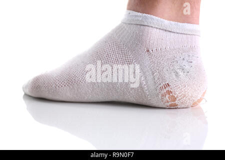 Ripped white sock on male leg isolated Stock Photo