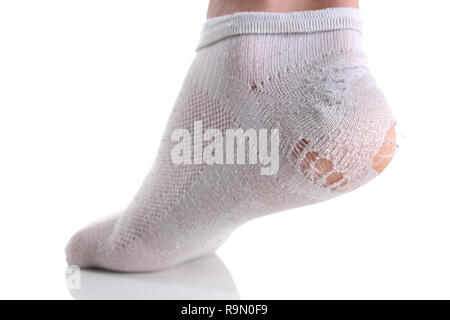 Ripped white sock on male leg isolated Stock Photo