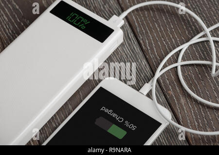 Smart phone being charged Stock Photo