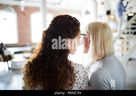 Gossip between colleagues Stock Photo