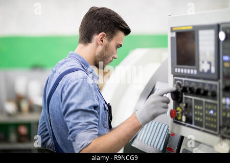 Mechanic working at factory Stock Photo
