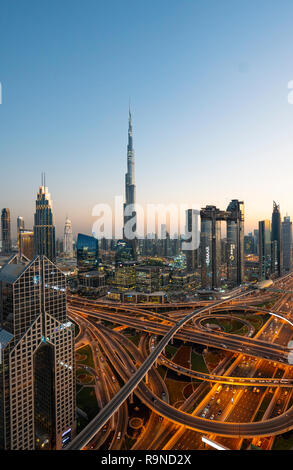 Skyline of Dubai, Sheikh Zayed Road and Burj Khalifa skyscraper at dusk in Dubai, United Arab Emirates Stock Photo