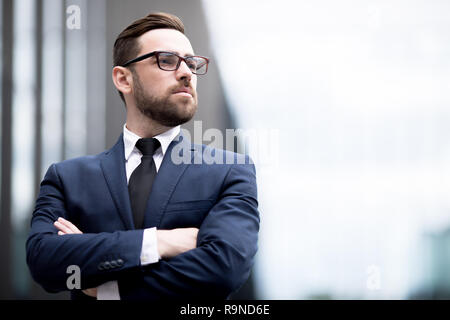 Stylish man crossing hands Stock Photo