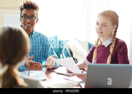Students talking to teacher Stock Photo
