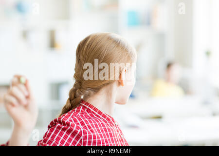 Girl doing sums Stock Photo
