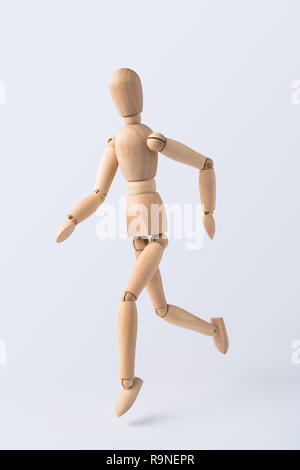 Wooden Running Mannequin Isolated On White High-Res Stock Photo