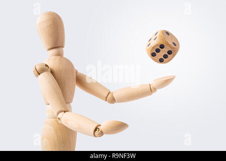Business and design concept - wooden mannequin with surreal dice cube isolated on white background Stock Photo