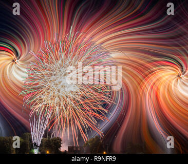 Colorfull fireworks display on the night sky with twirl effect Stock Photo