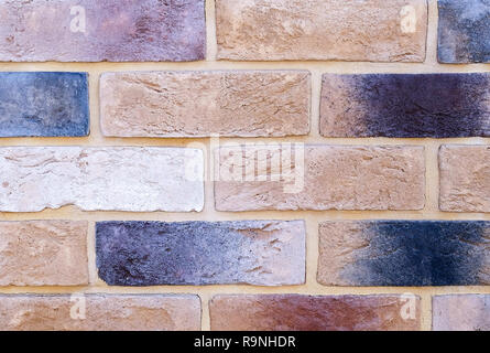 Silicate brick. Big and small. Different color. Decorative bricks. The texture of the walls. Stock Photo