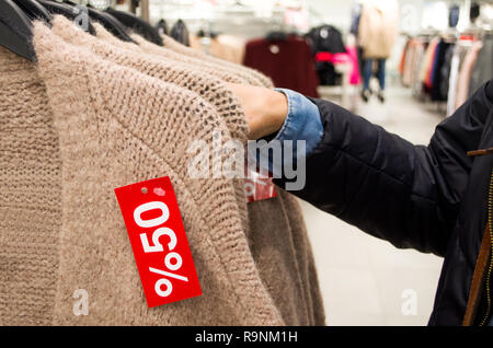 50 percent discount tag on new clothes Stock Photo