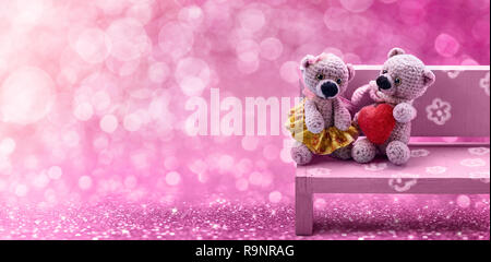 Valentine's Day, Couple sweet bears with heart on bright pink light Bokeh Background. Stock Photo