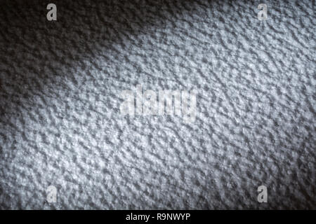 Rough surface of polystyrene ceiling tiles. Metaphor rough surface, abstract texture, rough texture, bumpy, insulation foam. Bumpy surface texture. Stock Photo