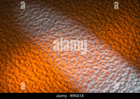 Rough surface of polystyrene ceiling tiles. Metaphor rough surface, abstract texture, rough texture, bumpy, insulation foam. Bumpy surface texture. Stock Photo