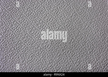 Rough surface of polystyrene ceiling tiles. Metaphor rough surface, abstract texture, rough texture, bumpy, insulation foam. Bumpy surface texture. Stock Photo