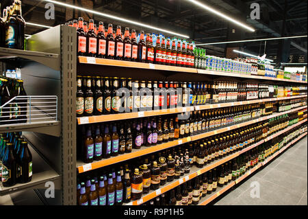 Kyiv, Ukraine - December 19, 2018: Different bottles of beer on supermarket stand shelves. Stock Photo