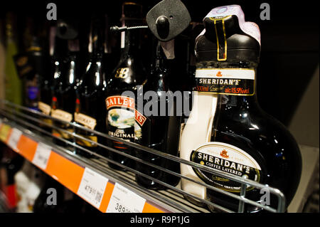 Kyiv, Ukraine - December 19, 2018: Bottles of Sheridan's and Baileys on shelves in a supermarket. Sheridan's is a liqueur first introduced in 1994. It Stock Photo