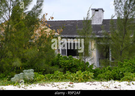 exterior of vacant run down residential house in the Bahamas Stock Photo