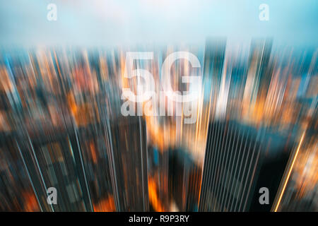 5G on a motion blurred city skyline illuminated at dusk Stock Photo