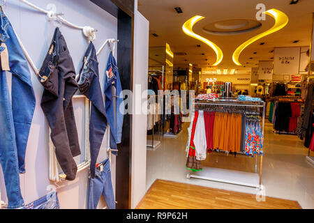 COLOMBO, SRI LANKA - SEPTEMBER 05, 2016:  Wide View of Ladies wear Clothes, Dresses, Skirts, Frocks, Trousers, Jackets, with Shelves, Racks and Hanger Stock Photo