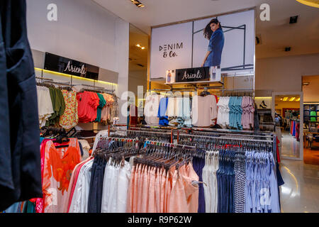 COLOMBO, SRI LANKA - SEPTEMBER 05, 2016:  Wide View of Ladies wear Clothes, Dresses, Skirts, Frocks, Trousers, Jackets, with Shelves, Racks and Hanger Stock Photo