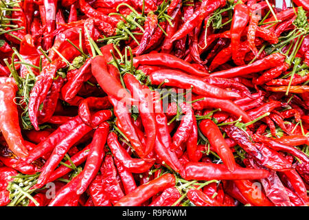 Hot red chilli Peppers at farmers market Spain hot peppers capsicum annuum chilli peppers Stock Photo