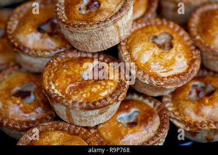 Artisan market stall selling homemade pork pies Stock Photo