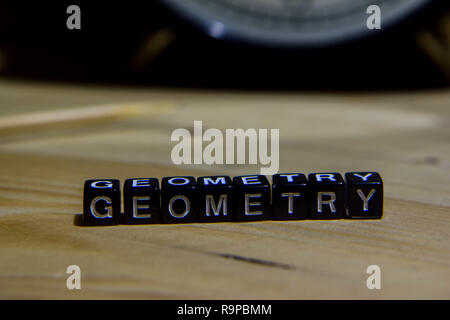 Geometry written on wooden blocks. Education and business concept on wooden background Stock Photo