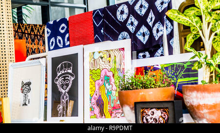 various art work; paintings and traditional clothes displayed Stock Photo