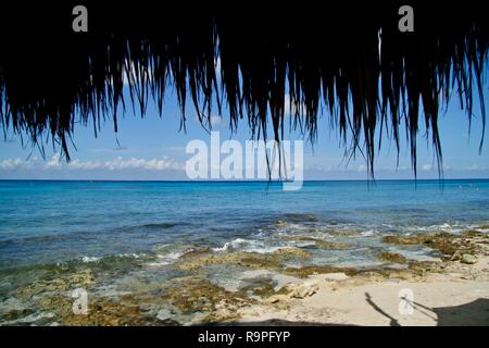 Looking out over the Caribbeans warm turquoise waters from a café on the beach Stock Photo