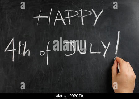 Hand writing Happy April fool s day on blackboard or chalkboard Stock Photo
