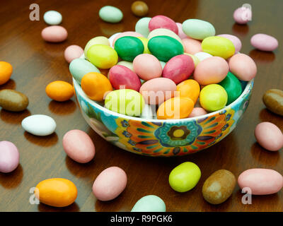 Bowl full sugar coated almonds on the table Stock Photo