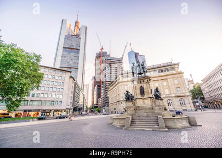 Johannes Gutenberg monument with skyscrapers of Frankfurt am Mein downtown, Germany Stock Photo