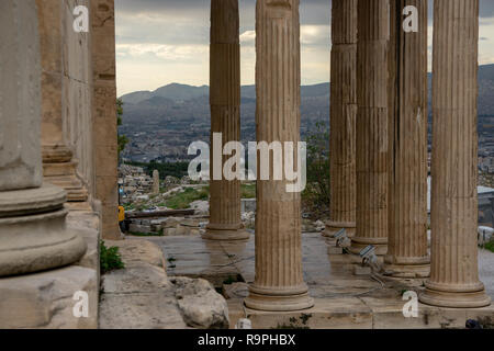 Seeing the city of Athens from atop of Acropolis through the marble ancient columns instantly made all the pains of travel disappear. Stock Photo