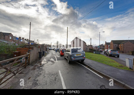 Pictured: The lane leading to the garage where the latest Banksy graffiti is located is full of parked cars in Port Talbot, Wales, UK. Thursday 20 Dec Stock Photo