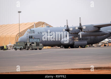 Niamey, Niger, 11 April 2018: A US Air Force USAF C-130H-3 Hercules stands on an airfield in Niamey, Niger, in a counter-terrorism support role