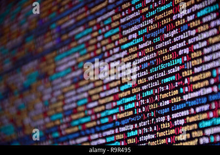 Software developer programming code on computer. Abstract computer script source code. Shallow depth of field, selective focus effect Stock Photo