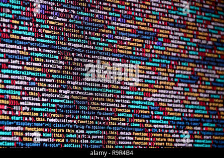 Software developer programming code on computer. Abstract computer script source code. Shallow depth of field, selective focus effect Stock Photo