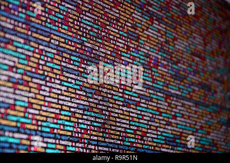 Software developer programming code on computer. Abstract computer script source code. Shallow depth of field, selective focus effect Stock Photo