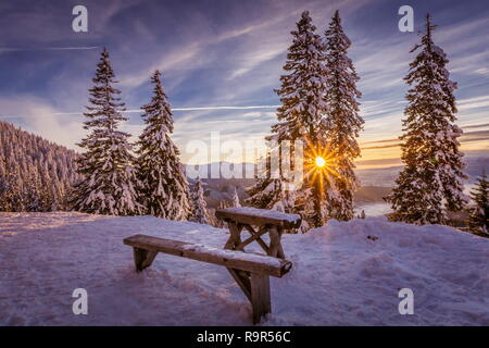 beautiful winter scene landscape at sunset - great winterscape wallpaper from Poiana Brasov Romania Stock Photo