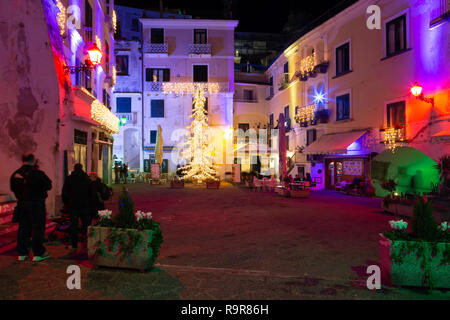 ATRANI, ITALY - DECEMBER 8, 2018: colored lights to celebrate Christmas in Atrani night, southern Italy Stock Photo