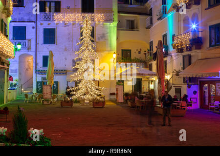 ATRANI, ITALY - DECEMBER 8, 2018: colored lights to celebrate Christmas in Atrani night, southern Italy Stock Photo