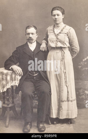 RUSSIA - CIRCA 1905-1910: Shot of married couple in studio, Vintage Carte de Viste Edwardian era photo Stock Photo